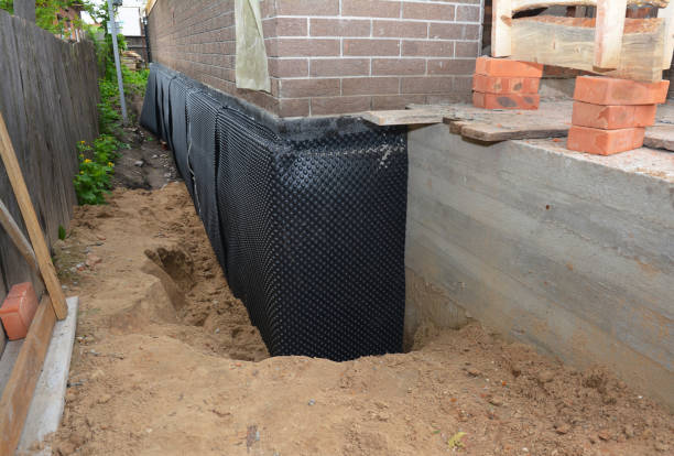 Happy homeowners after waterproofing job in Indian Head